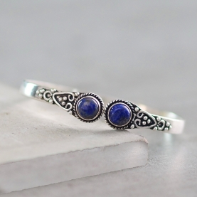 Metal bangle with lapis lazuli stones