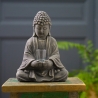 Bouddha en ciment avec verre à offrandes